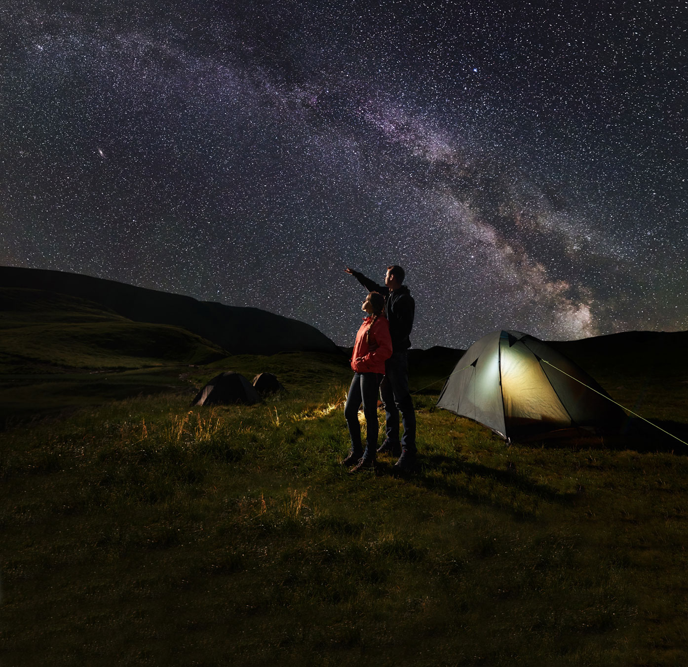 Man and woman looking at a starry sky